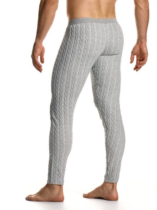 Man wearing gray textured leggings on a white background