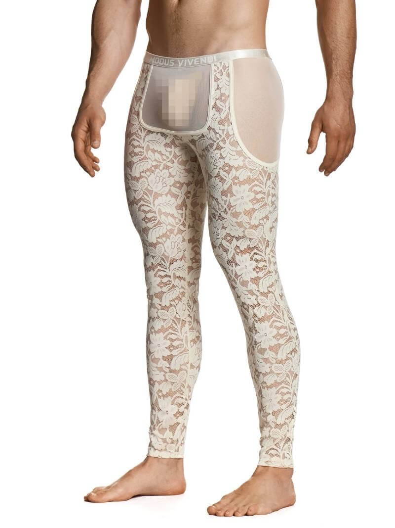 Man wearing a floral lace thong on a white background