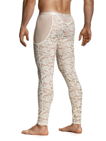 Man wearing a floral lace thong and leggings on a white background