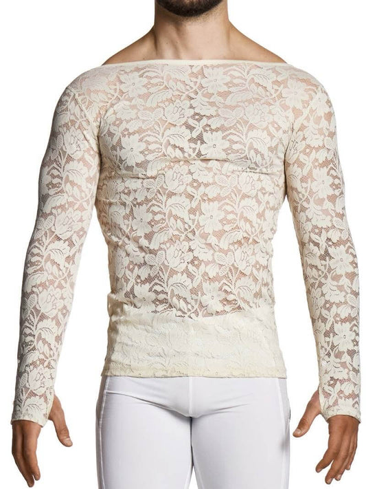 Man wearing a beige lace long-sleeve top and white pants on a white background