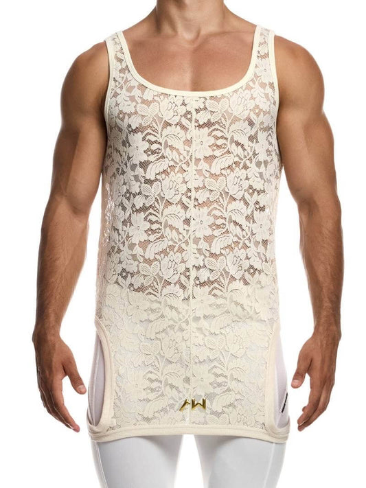 Man wearing a ivory lace tank top with white pants on a white background