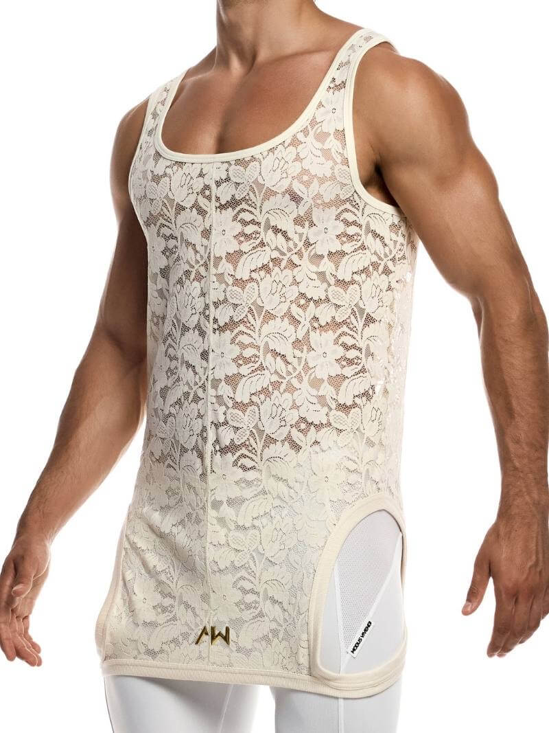 Man wearing a ivory lace tank top with floral patterns on a white background