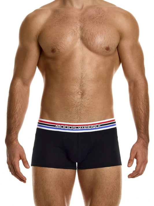 Man wearing black boxer briefs with a visible brand logo on a white background