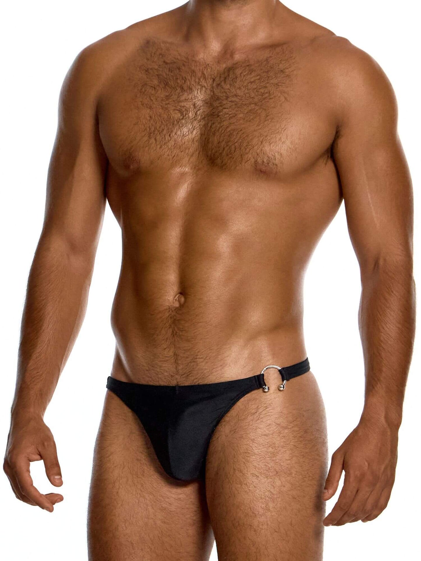Man wearing a black swim thong on a white background
