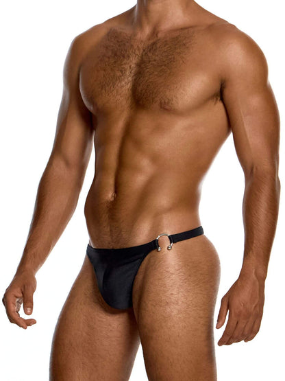 Man wearing a black swim thong on a white background
