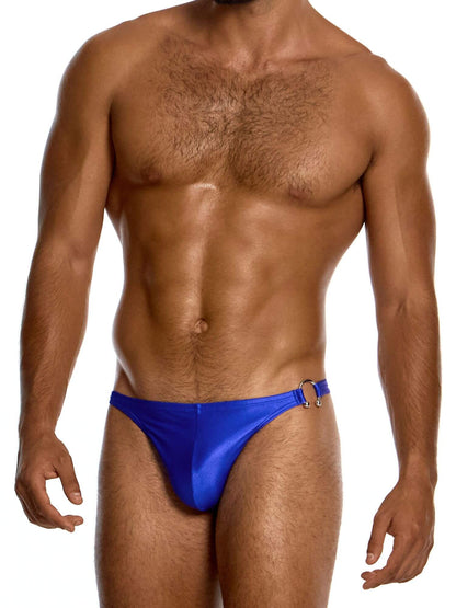 Man wearing a blue swim thong on a white background