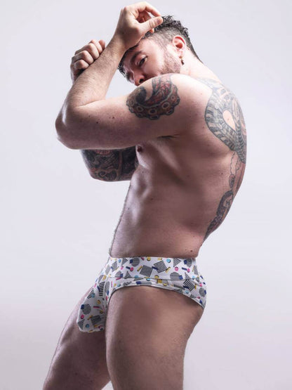 Man wearing patterned underwear against a plain background