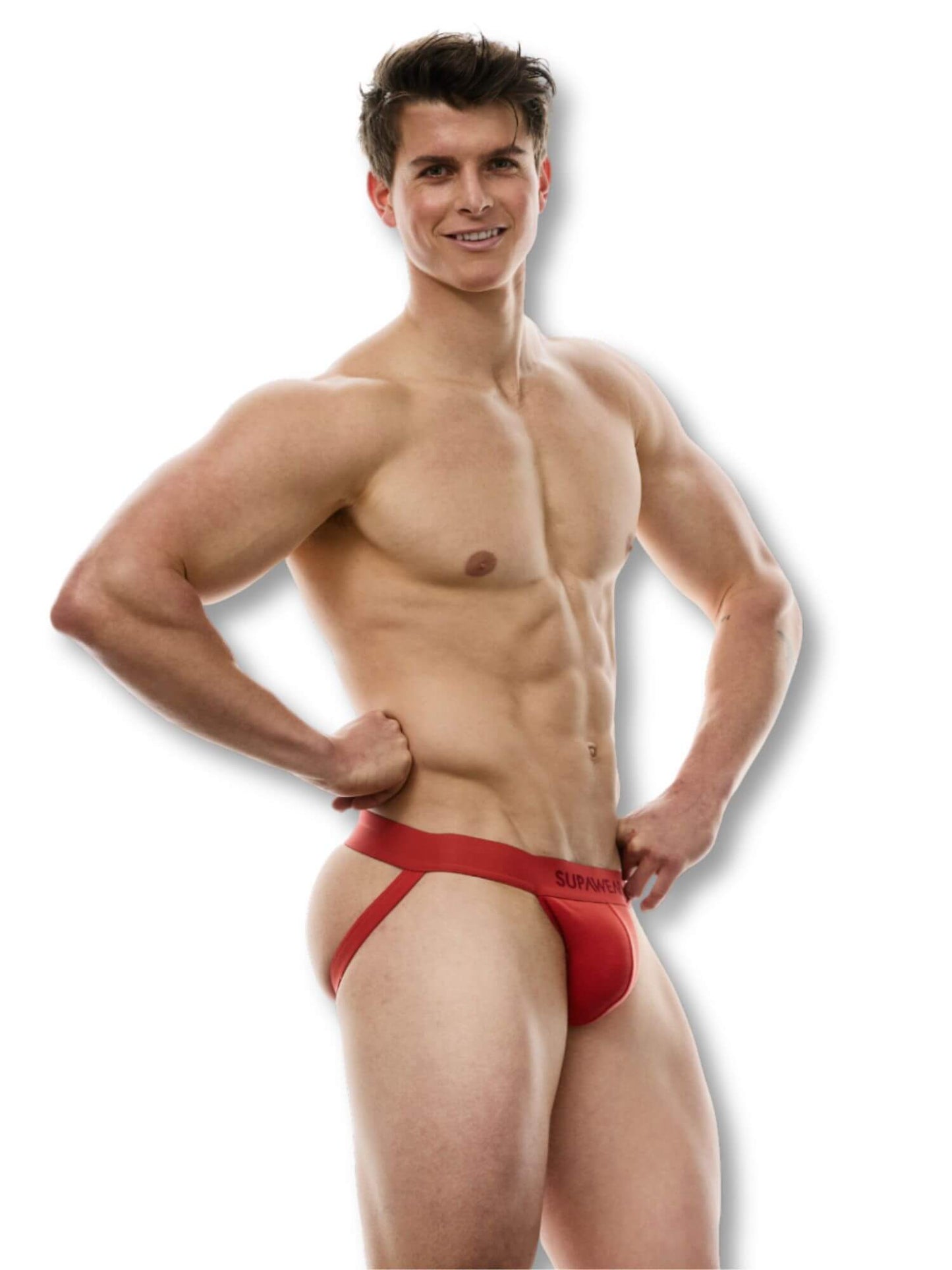 Man wearing a red thong against a white background