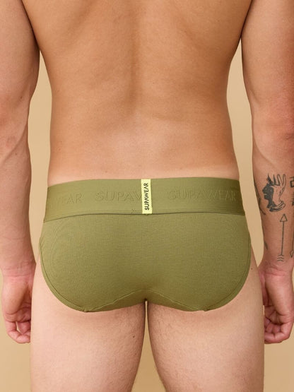 Green underwear with brand label on a beige background